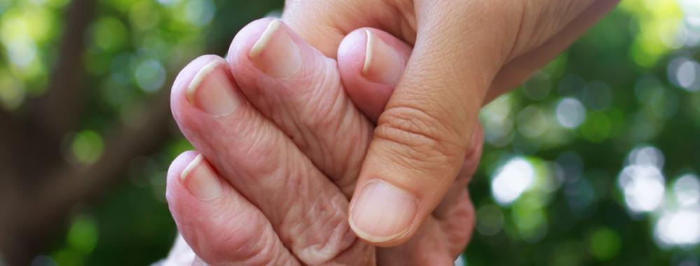 Senior and young holding hands.jpg